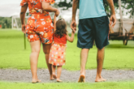 Family holding hands at a live4it event